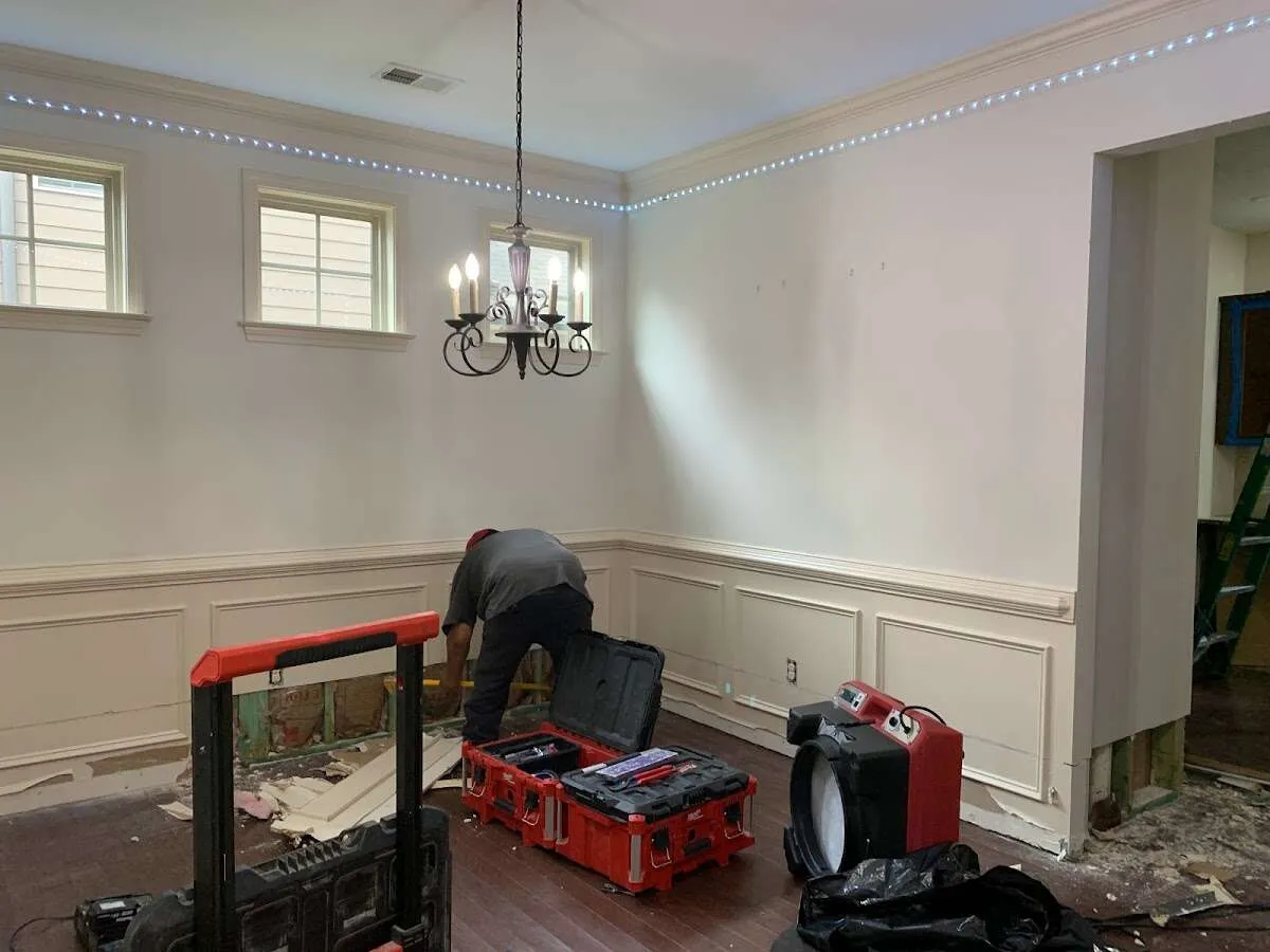 Restoration technician with professional equipment in Hudson